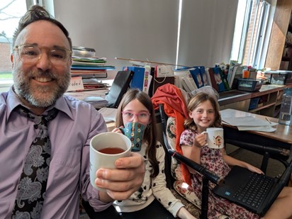 Photo of Mr. Perrone, Elora Jones, and Kinsley Abbe holding coffee mugs