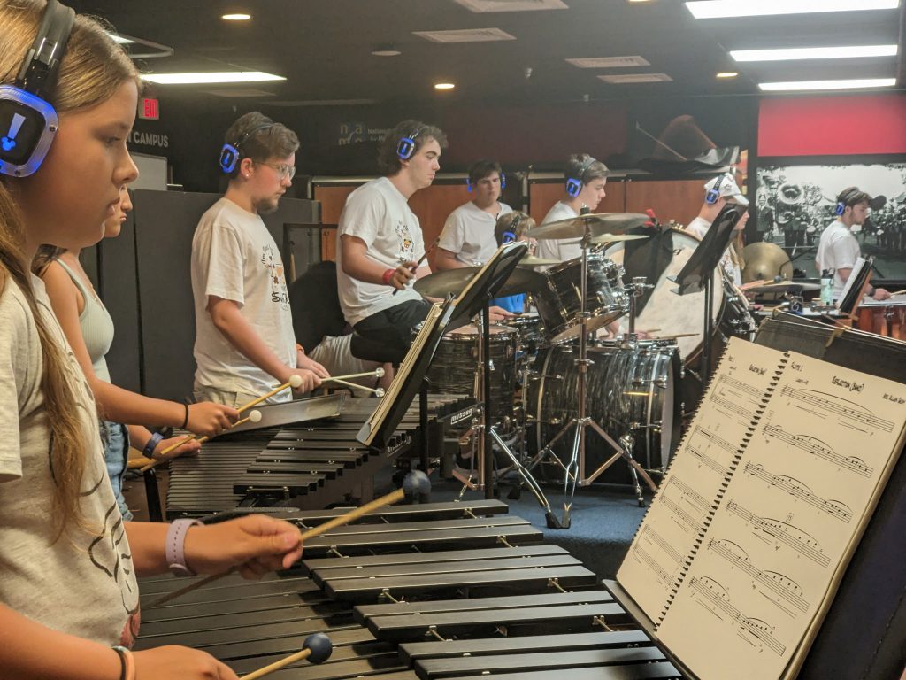 Photo of Waterville Central School marching band and swing choir students playing instruments at Walt Disney World’s Epcot