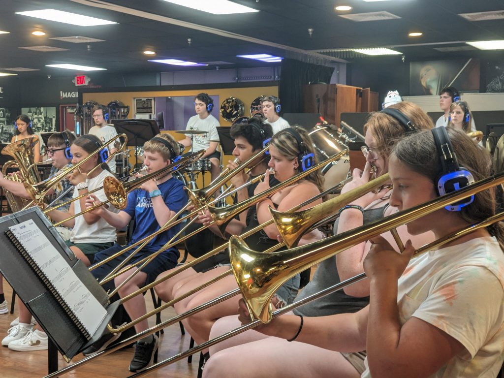 Photo of Waterville Central School marching band and swing choir students playing instruments at Walt Disney World’s Epcot