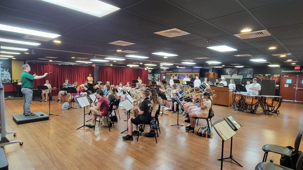 Photo of Waterville Central School marching band and swing choir students playing their instruments at Walt Disney World’s Epcot