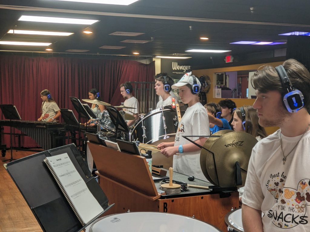 Photo of Waterville Central School marching band and swing choir students playing instruments at Walt Disney World’s Epcot