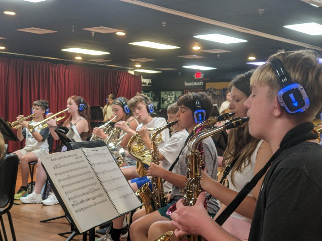 Photo of Waterville Central School marching band and swing choir students playing instruments at Walt Disney World’s Epcot