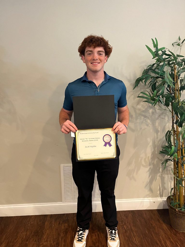 Photo of student holding certificate