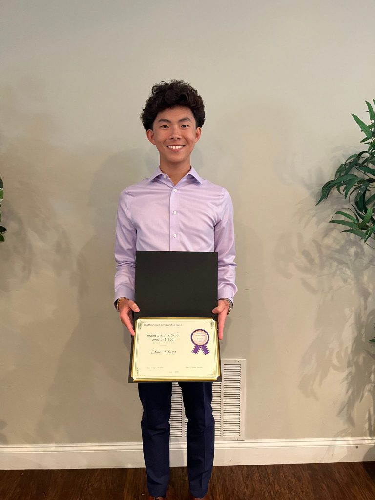 Photo of student holding a certificate