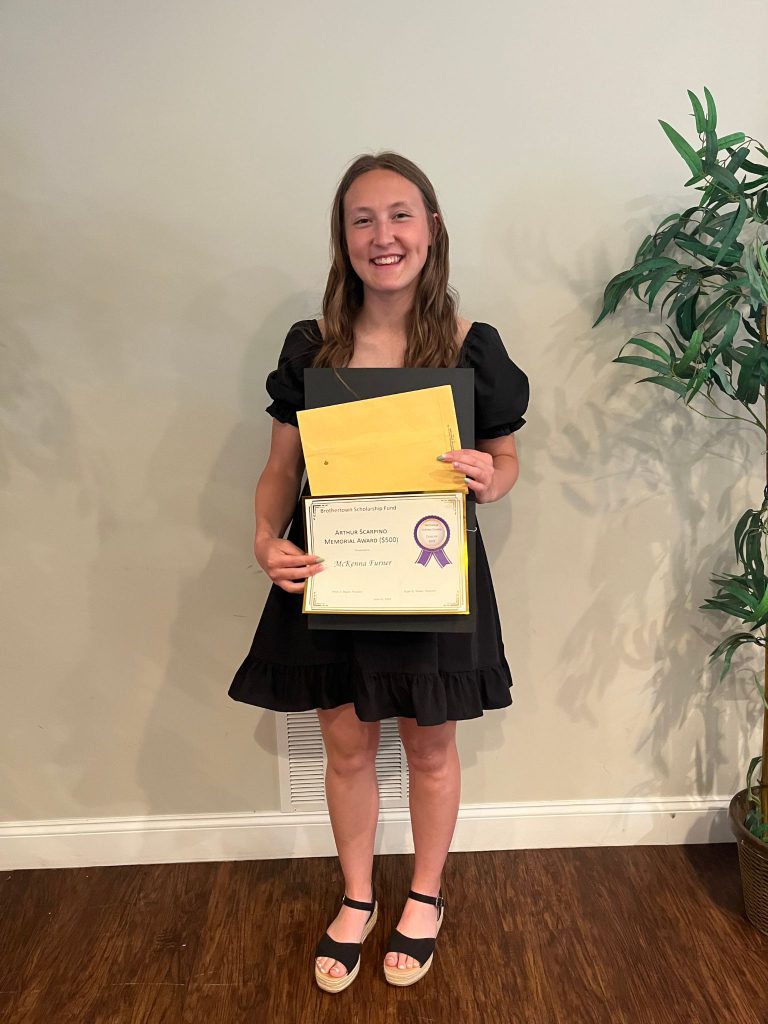 Photo of student holding certificate