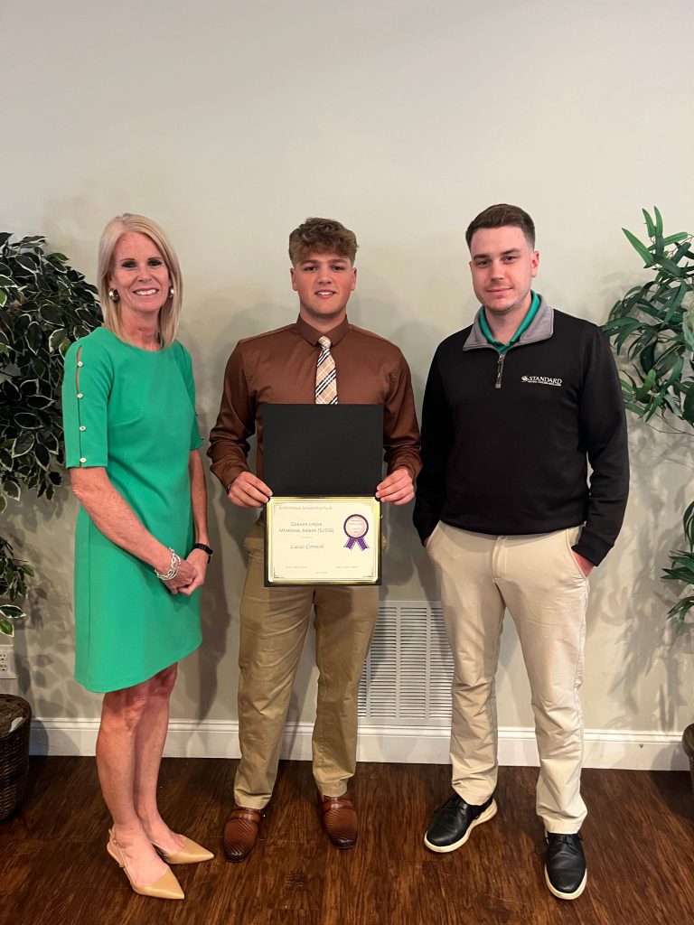 Photo of student holding certificate with two sponsors