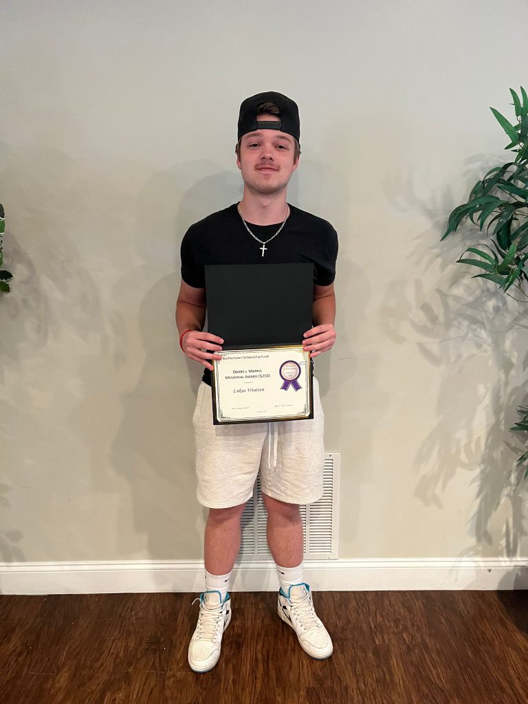 Photo of student holding a certificate