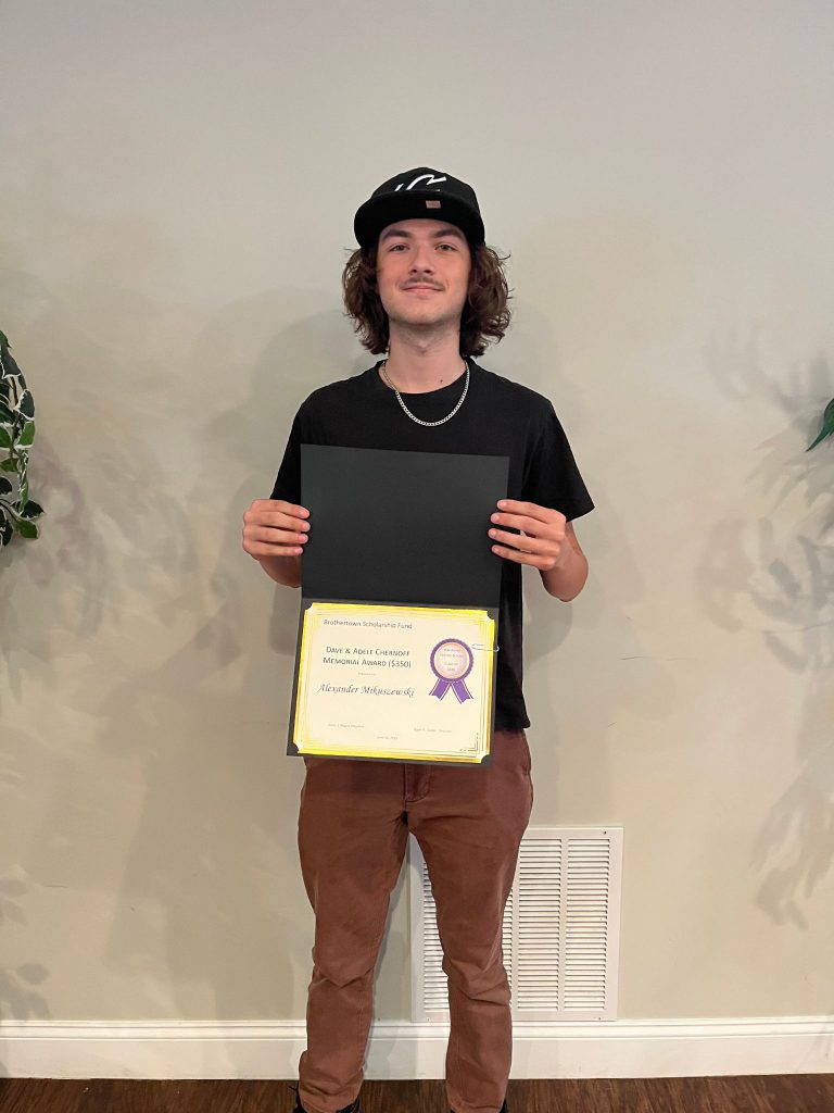 Photo of student holding a certificate