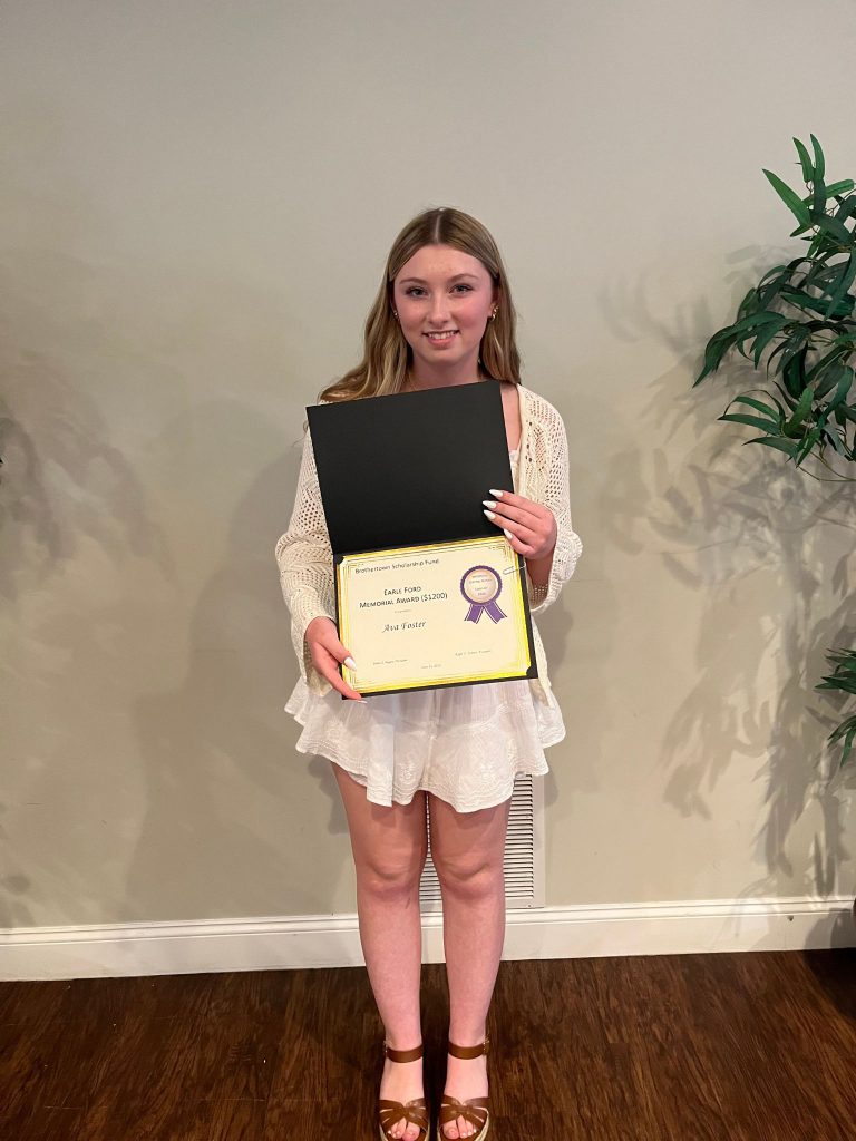 Photo of student holding certificate