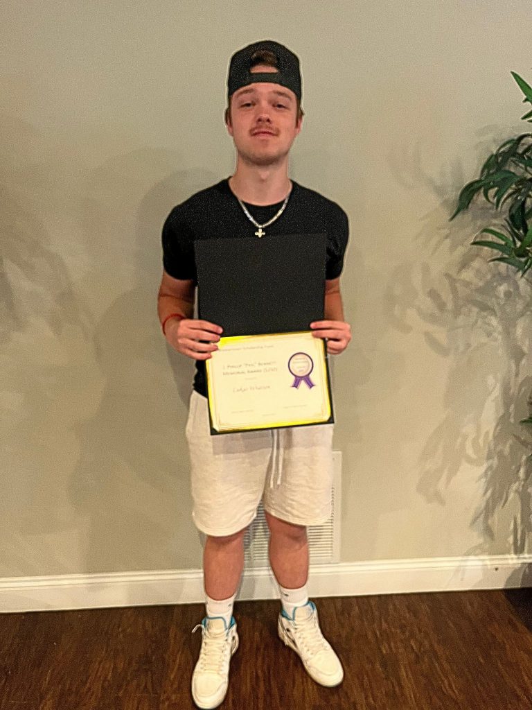 Photo of student holding a certificate