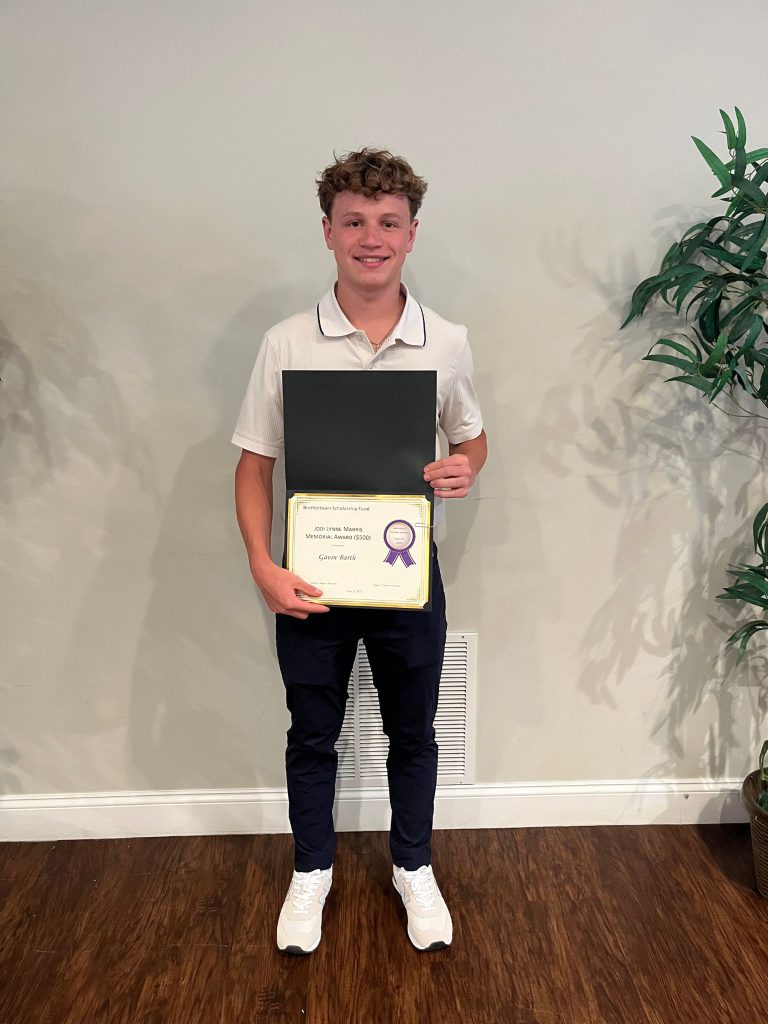 Photo of student holding a certificate