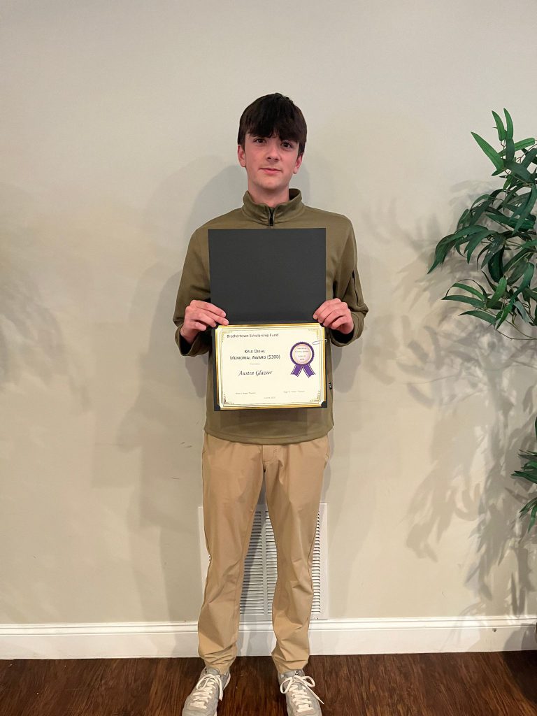 Photo of student holding a certificate