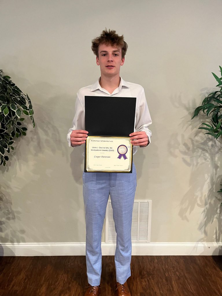 Photo of student holding a certificate