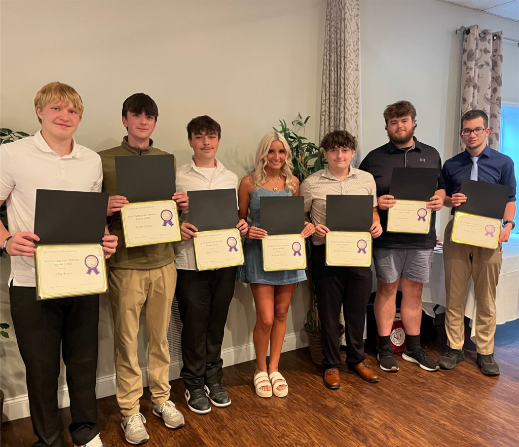 Seven students holding certificates