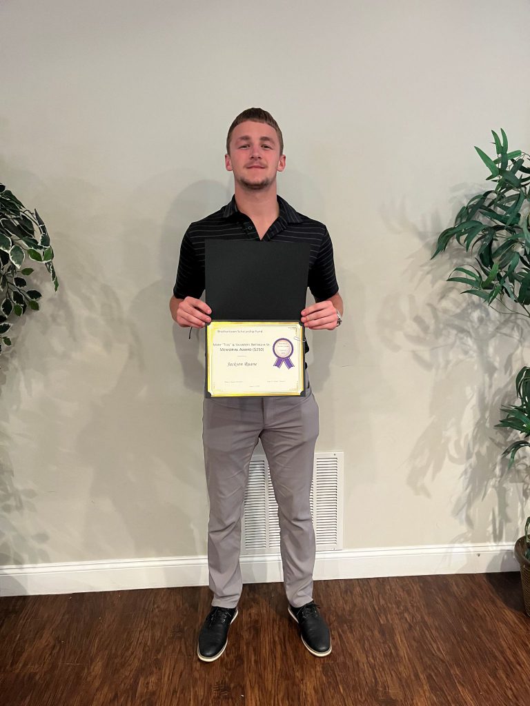 Photo of student holding a certificate