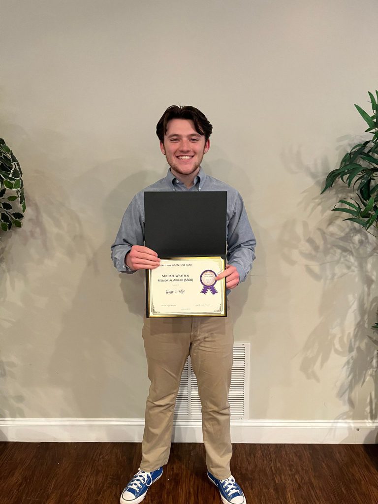 Photo of student holding a certificate