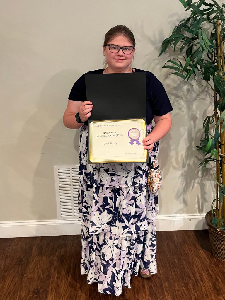 Photo of student holding certificate