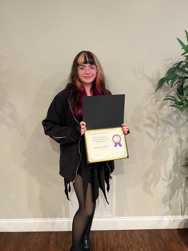 Photo of student holding a certificate