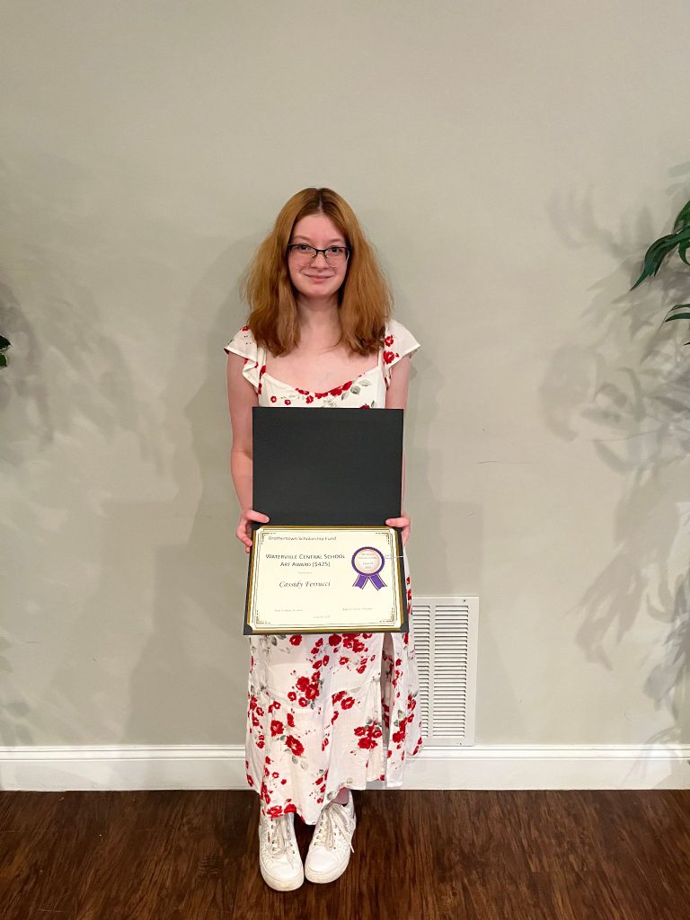 Photo of student holding a certificate