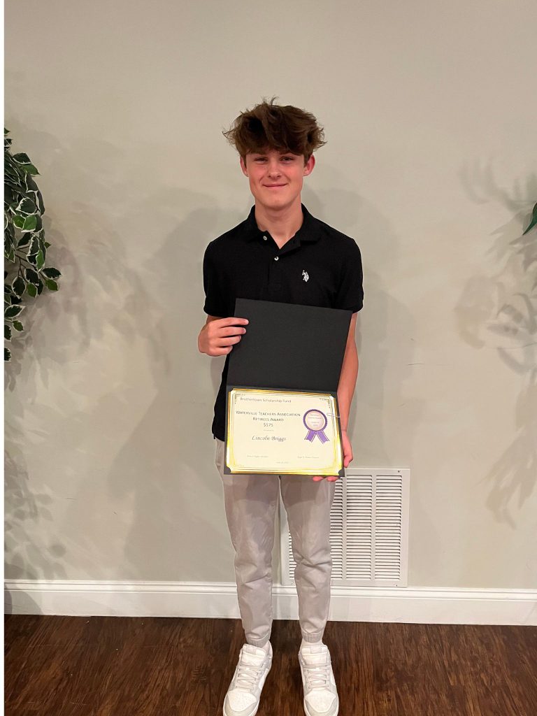Photo of student holding a certificate