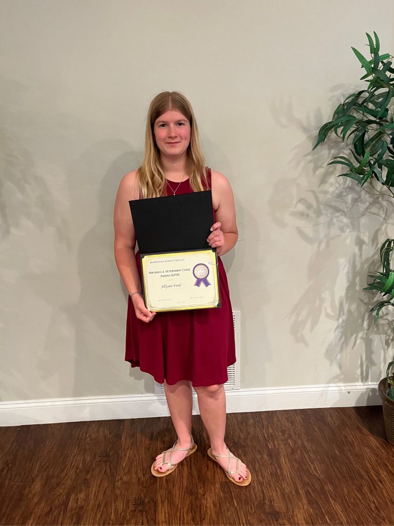 Photo of student holding a certificate