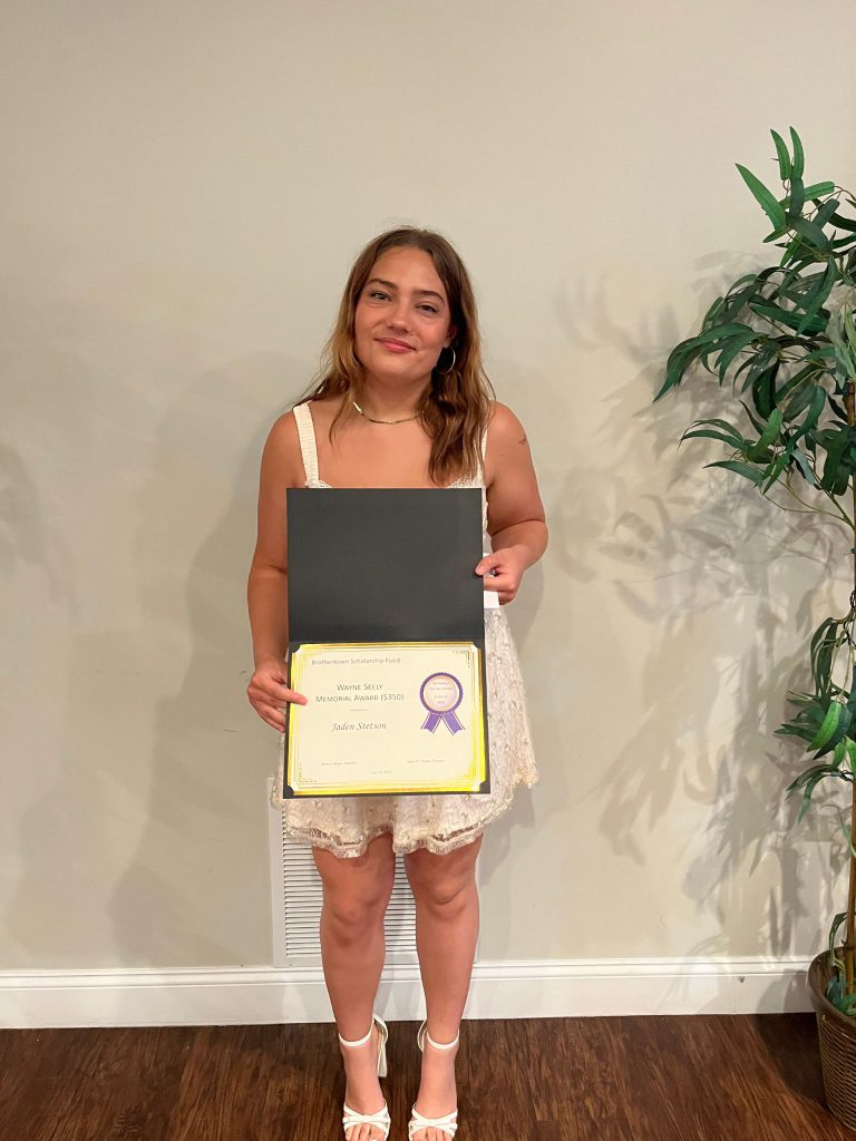 Photo of student holding a certificate