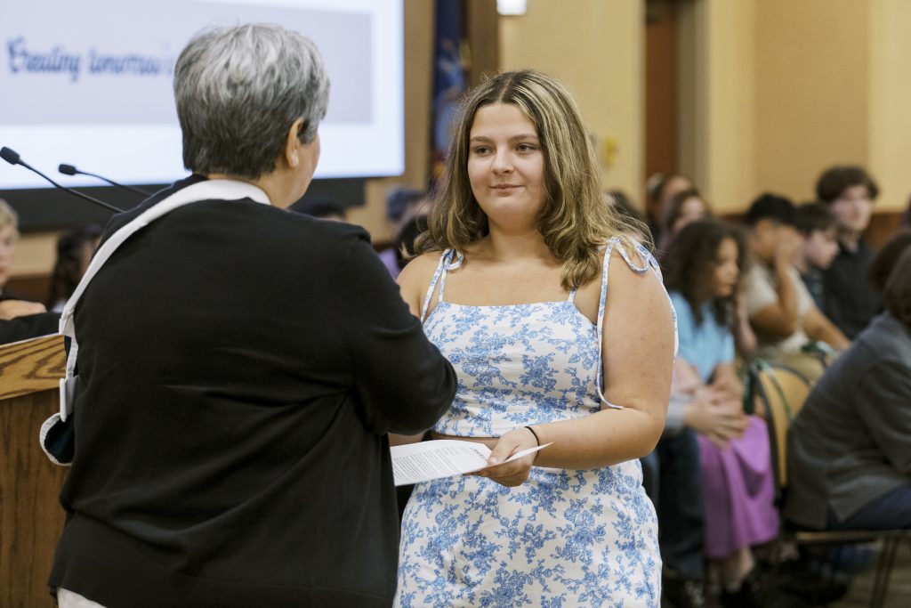 Photo of P-TECH student receiving a welcome letter