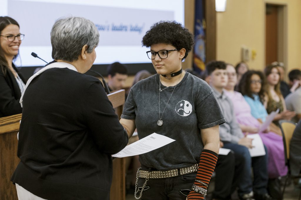 Photo of P-TECH student receiving a welcome letter